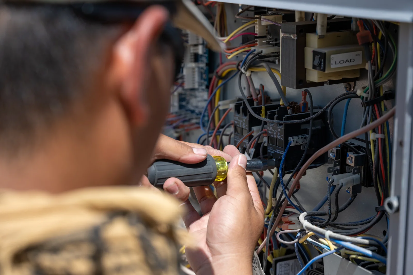 Technician servicing heating equipment